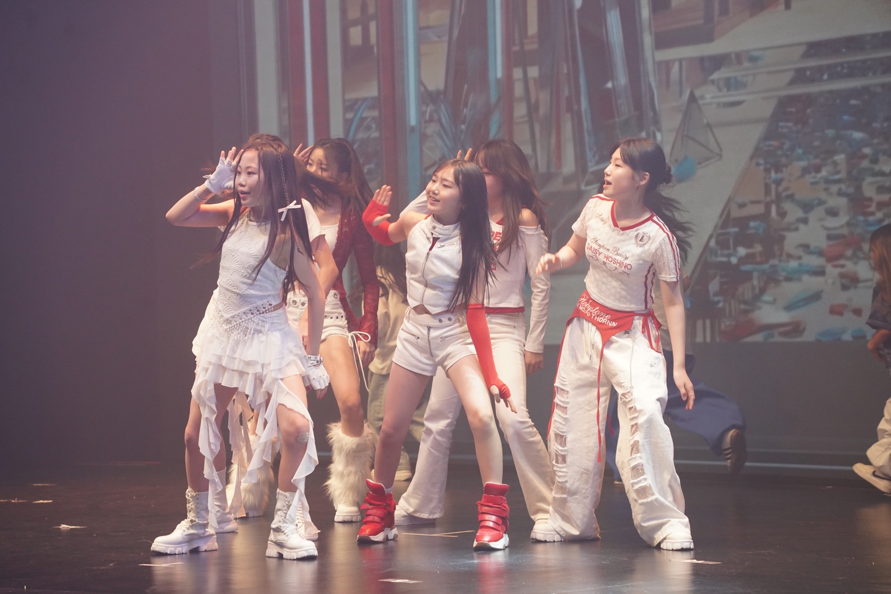 Performers in formation during a Keens Seoul stage shoot